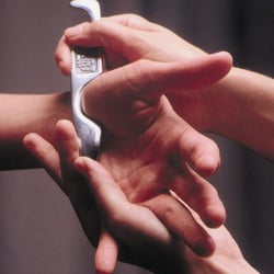 Mike Yusim, DC - Greenway Chiropractic - Graston instrument being used on the hand to treat carpal tunnel syndrome.