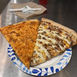 Buffalo Chicken and garlic sauce and chicken pizza by the slice. Buffalo Chicken and garlic sauce and chicken pizza by the slice.