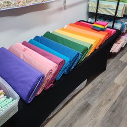Bay Quilts - Putting together kona fat quater bundles!!