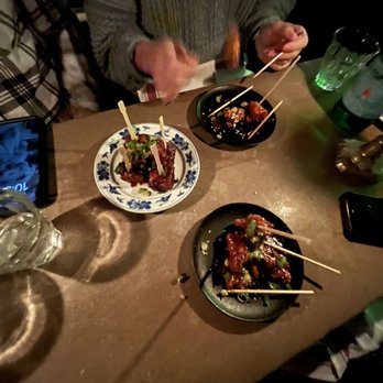 416 Snack Bar - a man eating a meal with chopsticks - Tapas/Small Plates Near Me - Toronto, Ontario