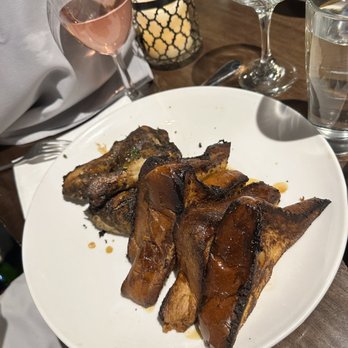 Negril Village - a plate of ribs and a glass of wine - Caribbean Near Me - New York, New York