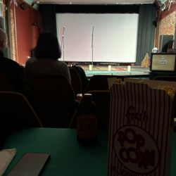 Pontiac's Little Art Theatre - The screen set up on stage. We selected seats with a table to place our popcorn and drinks.