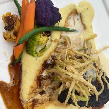Latitudes - Sunset Key Cottages - Grilled Center Cut Tenderloin with garlic mash, braised leek, seasoned veggies, Brie fondue and crispy leeks - Seafood Near Me - Key West, Florida