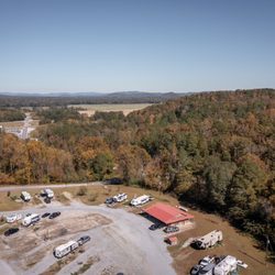 Scenic Drive RV Park and Campground - Aerial view of the office and RV sites with mountains beyond at Scenic Drive RV Park in Anniston, AL