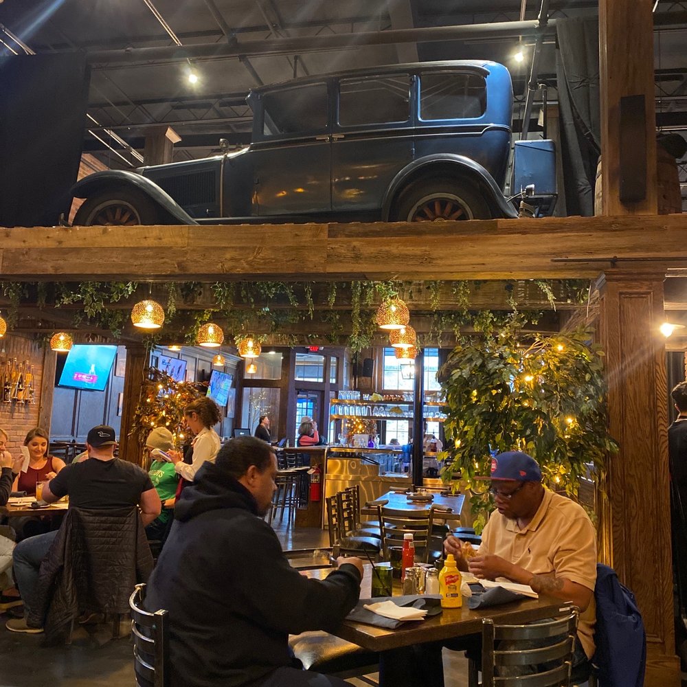 people sitting at tables in a restaurant people sitting at tables in a restaurant