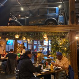 people sitting at tables in a restaurant people sitting at tables in a restaurant