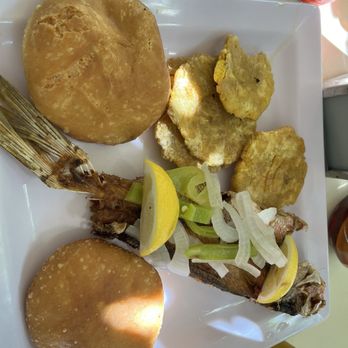 Rancho Choli - Yellow fish tail with arepas and tostones - Latin American Near Me - Vieques, Puerto Rico