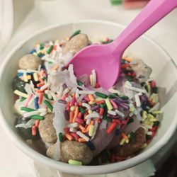 sweetFrog Premium Frozen Yogurt - Ube froyo with sprinkles. Chocolate covered almonds, and coconut