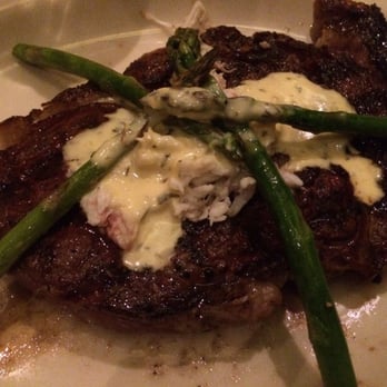 Harry & Izzy's - Ribeye steak, Oscar style (asparagus, crab cakes and bearnaise sauce). - Steakhouses Near Me - Indianapolis, Indiana Harry & Izzy's - Ribeye steak, Oscar style (asparagus, crab cakes and bearnaise sauce). - Steakhouses Near Me - Indianapolis, Indiana