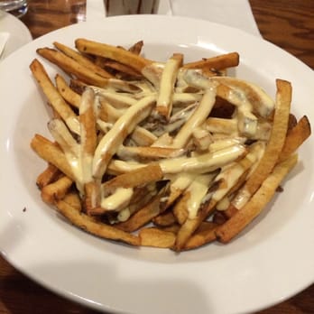 Relish - Big bowl of cheese fries with almond joy shake back there - American Near Me - Kings Park, New York Relish - Big bowl of cheese fries with almond joy shake back there - American Near Me - Kings Park, New York
