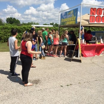 D'em Dogz "Chicago Style" - a group of people standing under a tent - Caterers Near Me D'em Dogz "Chicago Style" - a group of people standing under a tent - Caterers Near Me