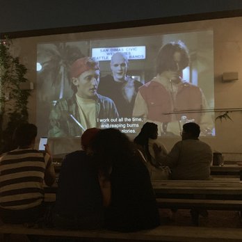 Axelrad - Bill & Ted's Bogus Journey on the projector. - Beer Gardens Near Me - Houston, Texas