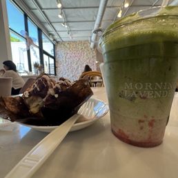 Strawberry Matcha Latte with a side pastry of Cinnamon Pull Apart.