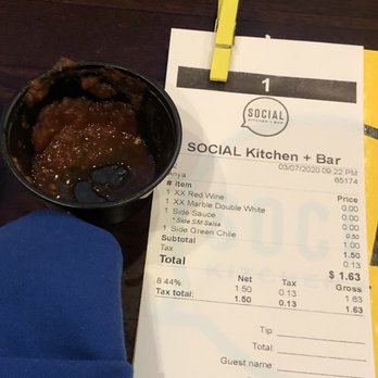 Social Kitchen + Bar - a bowl of food and a menu - Lounges Near Me - Santa Fe, New Mexico