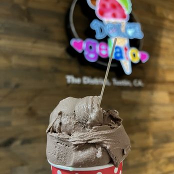 Dolce Gelato - a hand holding a cup of ice cream - Ice Cream & Frozen Yogurt Near Me - Tustin, California Dolce Gelato - a hand holding a cup of ice cream - Ice Cream & Frozen Yogurt Near Me - Tustin, California
