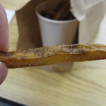 Five Guys - Close-up view of one overcooked, oversalted, potato skin-covered French fry - Burgers Near Me - Redmond, Washington Five Guys - Close-up view of one overcooked, oversalted, potato skin-covered French fry - Burgers Near Me - Redmond, Washington