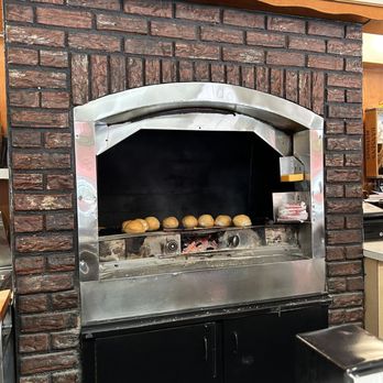 Mickey-Lu-Bar-B-Q - e shows a brick oven in a restaurant - Barbeque Near Me - Marinette, Wisconsin