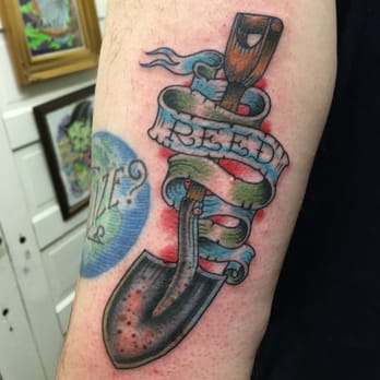 Bright and Bold Tattoo - Freshly inked (still a bit of blood) shovel tattoo in memory of a relative by Jason Mendoza. - Tattoo Near Me - San Antonio, Texas