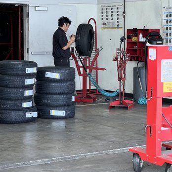 America's Tire - The hardworking mechanic fixing the hole - Tires Near Me - Fullerton, California