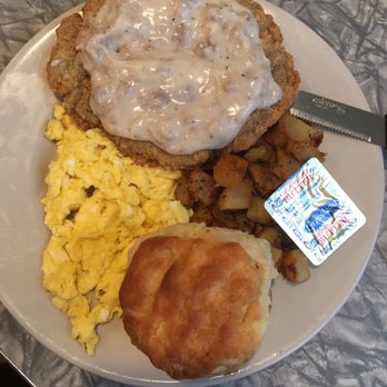 Henrys Diner - Chicken fried steak w/sausage gravy, 2 eggs scrambled, home fries and a biscuit!  A meal fit for a King! - Diners Near Me - Burlington, Vermont