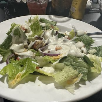 The Piper - a plate of salad with dressing - Burgers Near Me - Noblesville, Indiana