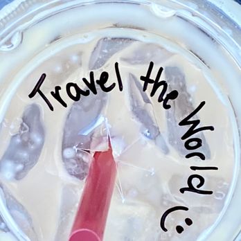 Aroma Joe's - a plastic cup with a straw and a straw in it that says travel the world - Cafes Near Me - Rochester, New Hampshire