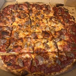 ZaRonis Pizza - Thin crust, cooked 'well' with double sausage and tomatoes. The crust is pretty good.