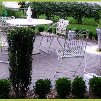 Natural Green Landscaping & Design - a patio with a table and chairs - Landscaping Near Me - Rehoboth, Massachusetts Natural Green Landscaping & Design - a patio with a table and chairs - Landscaping Near Me - Rehoboth, Massachusetts