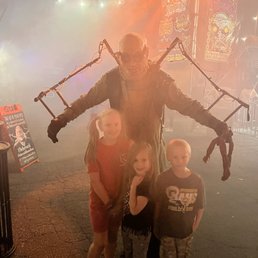 My kids getting a picture with one of the scary characters My kids getting a picture with one of the scary characters