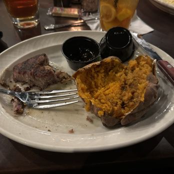 The Peddler Steak House - Grill Pork Chop and Baked Sweet Potato - Steakhouses Near Me - Florence, South Carolina The Peddler Steak House - Grill Pork Chop and Baked Sweet Potato - Steakhouses Near Me - Florence, South Carolina