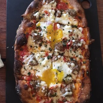 Serious Pie Downtown - Fennel sausage with added soft eggs - Pizza Near Me - Seattle, Washington Serious Pie Downtown - Fennel sausage with added soft eggs - Pizza Near Me - Seattle, Washington