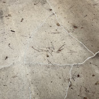 Blue Tide Exteriors - Cracks all over the patio filled in by Jordan Strader himself. - Roofing Near Me - Shreveport, Louisiana