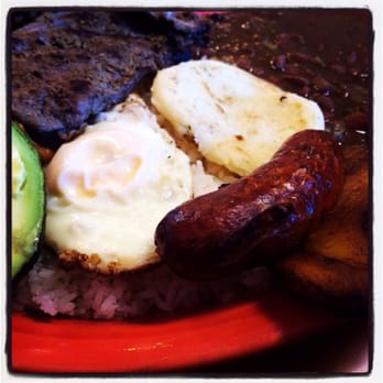 Mr. Valdez Latin Cafe - Bandeja Paisa - beans, steak, sweet plantains, pork skin, columbian sauce, rice, avocado, fried egg and arepa - Colombian Near Me - Norcross, Georgia