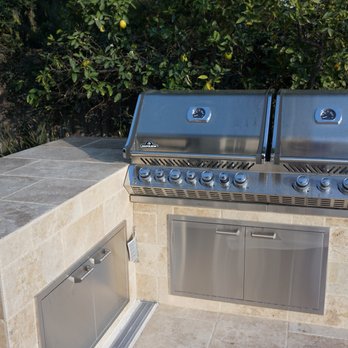 Patio Dudes - Built-in natural gas grill with travertine storage and cooking/serving surfaces. - General Contractors Near Me - Calabasas, California