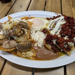 Chilaquiles half green half red sauce with chille Verde and chorizo. Chilaquiles half green half red sauce with chille Verde and chorizo.