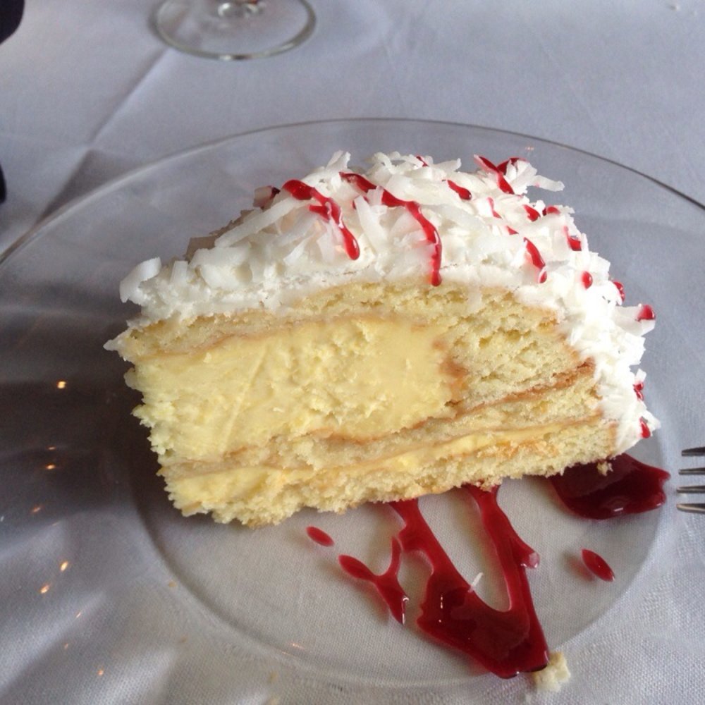Brasserie Circa - Coconut cake with a creamy center. - New American Near Me - Macon, Georgia Brasserie Circa - Coconut cake with a creamy center. - New American Near Me - Macon, Georgia