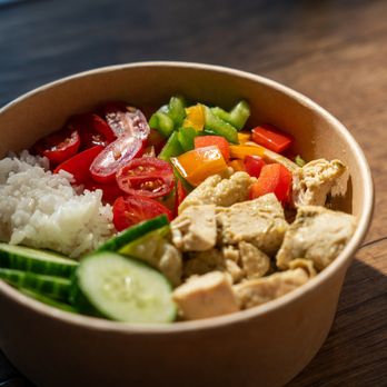 Fusion Feast - Thai Chicken Bowl - Flavorful fusion of tender Thai chicken curry with crunchy veggies. - Salad Near Me - Ottawa, Ontario Fusion Feast - Thai Chicken Bowl - Flavorful fusion of tender Thai chicken curry with crunchy veggies. - Salad Near Me - Ottawa, Ontario