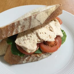 Roast chicken sandwich with tomato, leaves, mustard mayo Roast chicken sandwich with tomato, leaves, mustard mayo