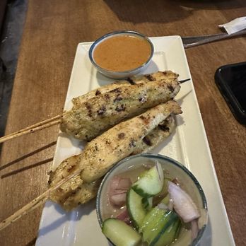 Teton Thai - Chicken satay with cucumber salad and peanut sauce. - Thai Near Me - Teton Village, Wyoming Teton Thai - Chicken satay with cucumber salad and peanut sauce. - Thai Near Me - Teton Village, Wyoming