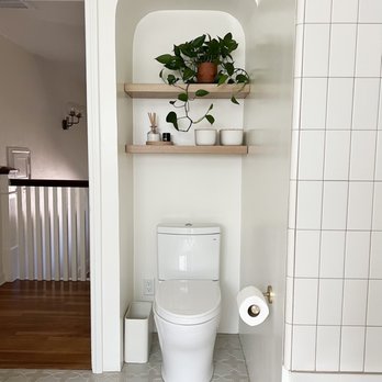 Garcia Tile - a white toilet in a bathroom - General Contractors Near Me - Santa Clara, California Garcia Tile - a white toilet in a bathroom - General Contractors Near Me - Santa Clara, California