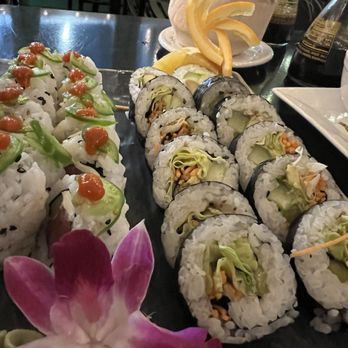 Volcanic Sushi + Sake - Jason 1 roll on the left. Looks very sexy. Vegetable roll on the right. - Sushi Bars Near Me - Gainesville, Florida