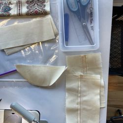 Sewing tools kit and practice pieces