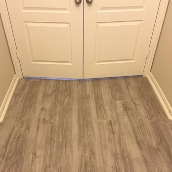 Texas Flooring and More - a white door and a wood floor - Flooring Near Me Texas Flooring and More - a white door and a wood floor - Flooring Near Me