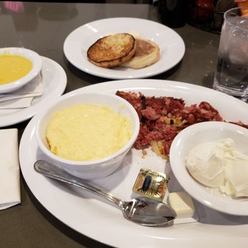 Cozy Corner - Harlem Ave - Corned beef hash and 2 Eggs (poached) with cheesy grits, English muffin, and a side of hollandaise - Breakfast & Brunch Near Me - Chicago, Illinois Cozy Corner - Harlem Ave - Corned beef hash and 2 Eggs (poached) with cheesy grits, English muffin, and a side of hollandaise - Breakfast & Brunch Near Me - Chicago, Illinois