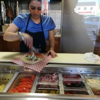 Adia's Donair - a woman preparing food - Donairs Near Me - Calgary, Alberta
