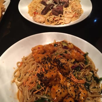 Dave & Buster's Denver - Top: steak & shrimp Alfredo. Bottom: bang bang shrimp on top of pad Thai noodles. Both were very delicious! - American Near Me - Denver, Colorado