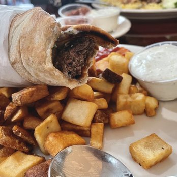 Real Olive - Beef kofta sandwich with Greek potatoes - Mediterranean Near Me - Lawrenceville, Georgia Real Olive - Beef kofta sandwich with Greek potatoes - Mediterranean Near Me - Lawrenceville, Georgia