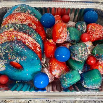 Rio’s Eats & Treats - a tray of colorful donuts - Desserts Near Me Rio’s Eats & Treats - a tray of colorful donuts - Desserts Near Me