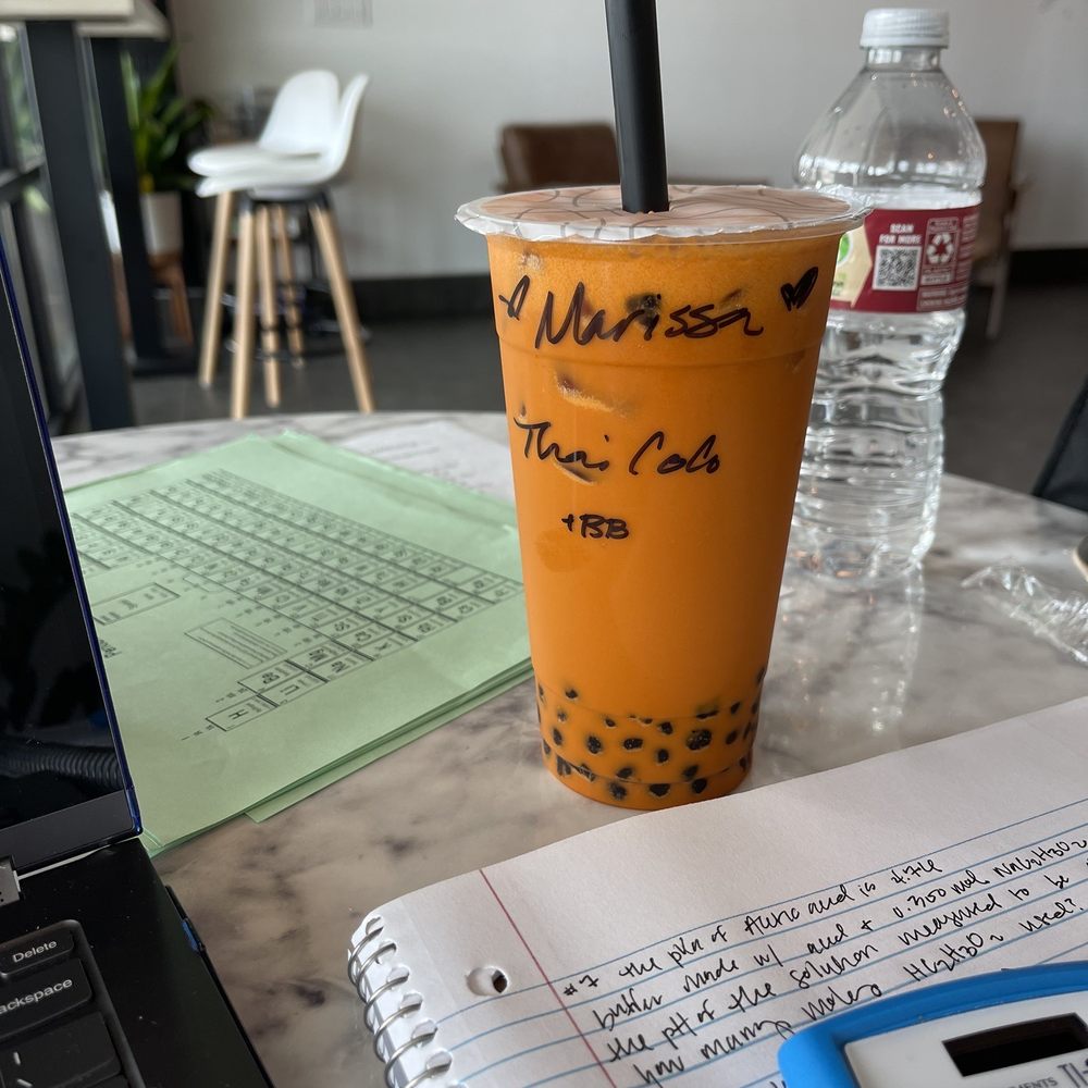 a cup of iced tea and a calculator a cup of iced tea and a calculator