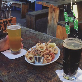 Mua - Fried calamari with the ballast point (left) and Tokyo black porter (right) - Bars Near Me - Oakland, California Mua - Fried calamari with the ballast point (left) and Tokyo black porter (right) - Bars Near Me - Oakland, California